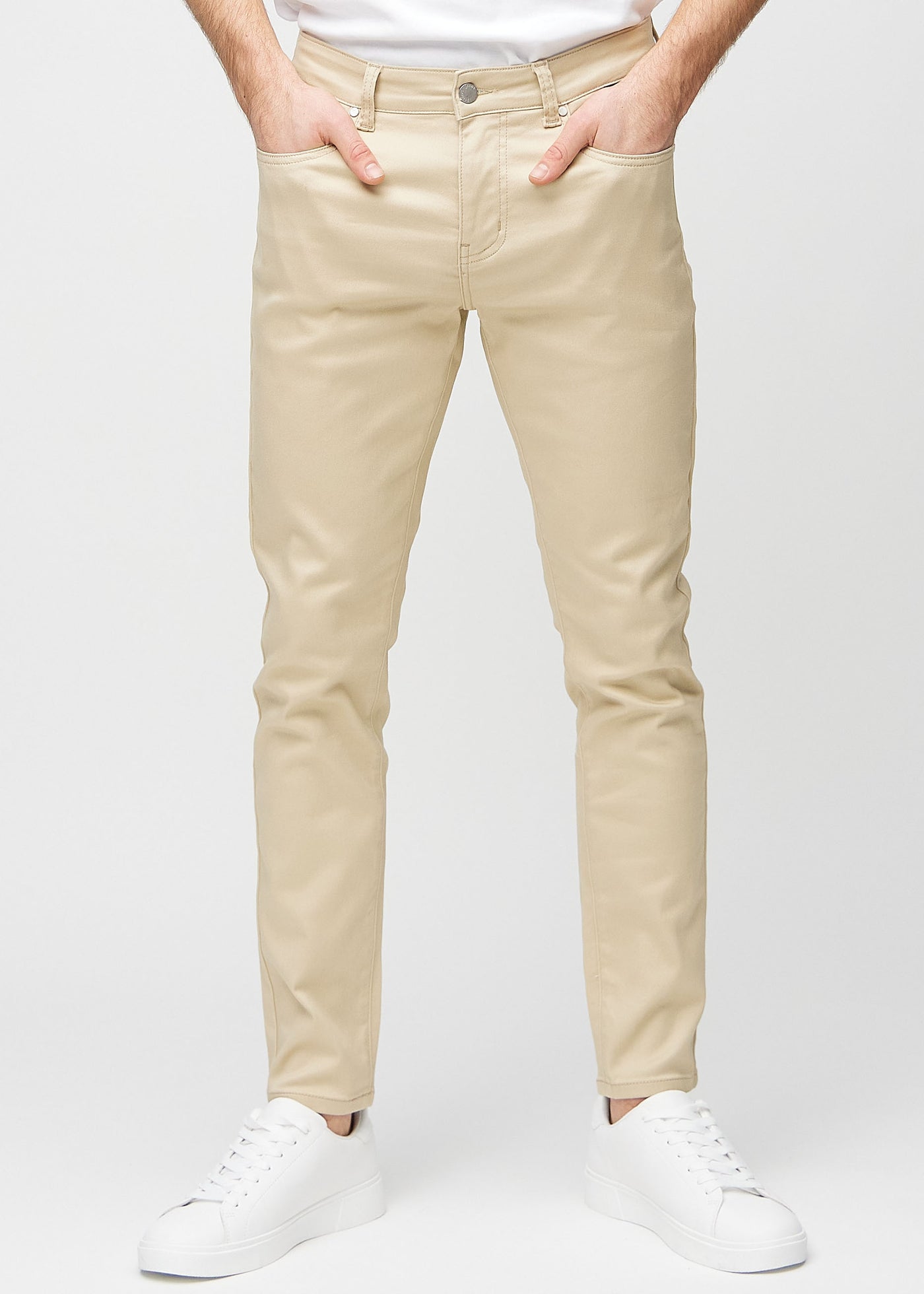 Beige slim jeans, modelnavn Gazelles, som sidder tæt til benet, set forfra.