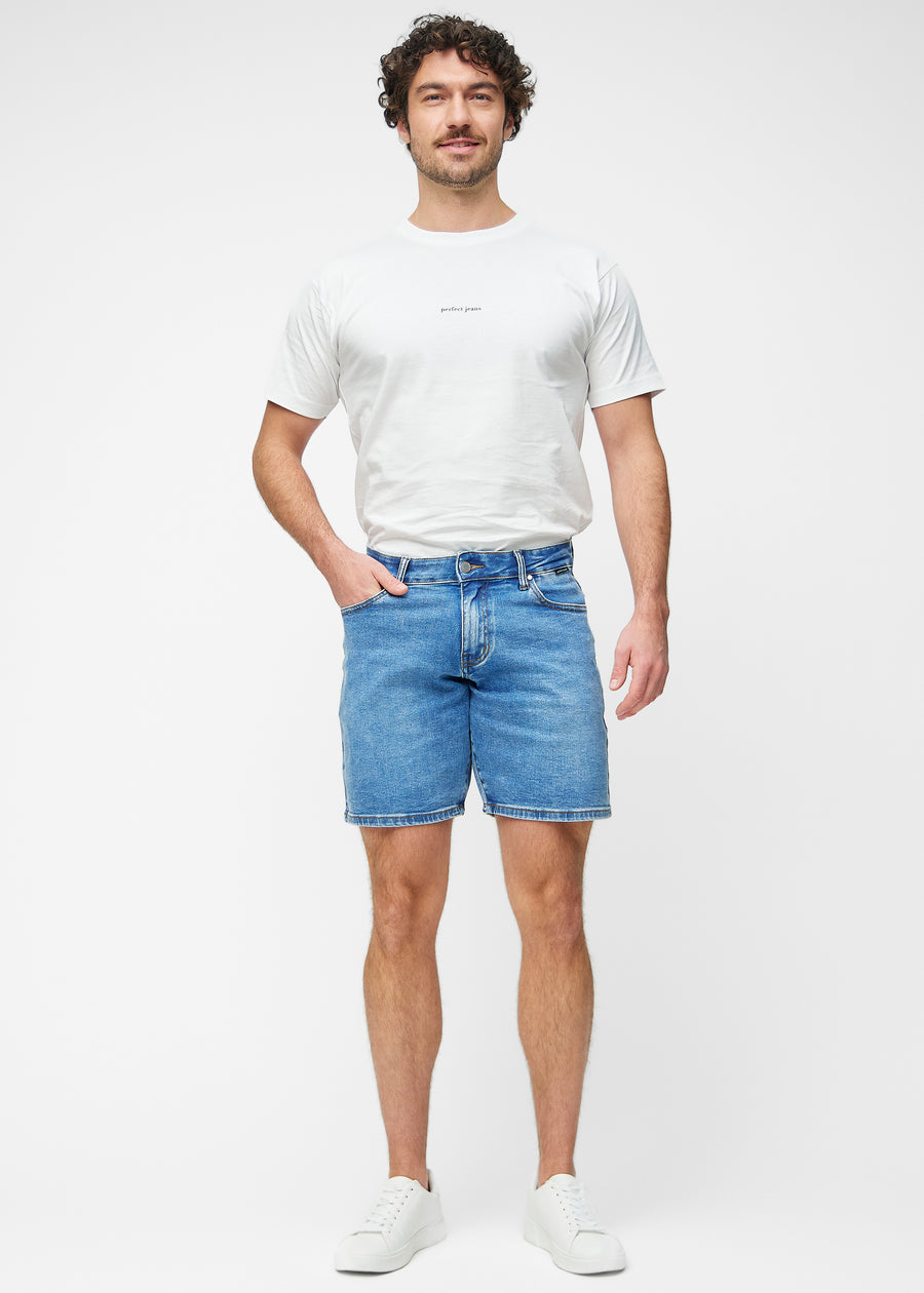 Full image of a model wearing blue denim shorts for men in the colour Rivers with a regular fit.