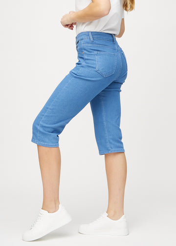 Blue regular capris seen from the side on a model.