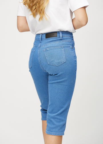 Blue regular capris seen from the back close up to show details.