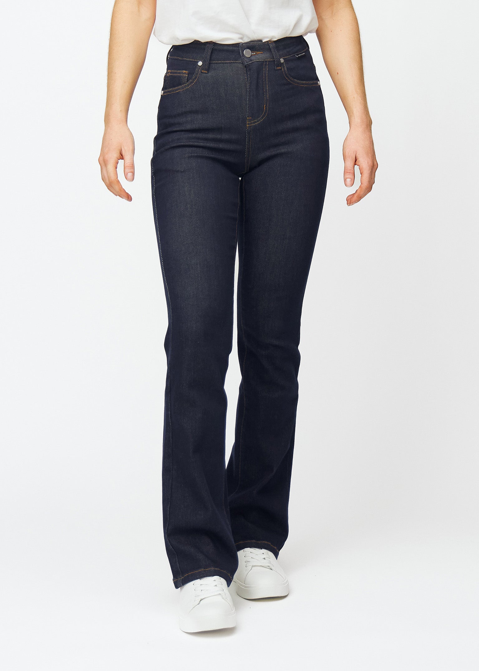 Deep dark blue denim jeans for women in the colour Midnights with a bootcut fit that is fitted over the hips and thighs and has a slight flare at the ankles, seen from the front.