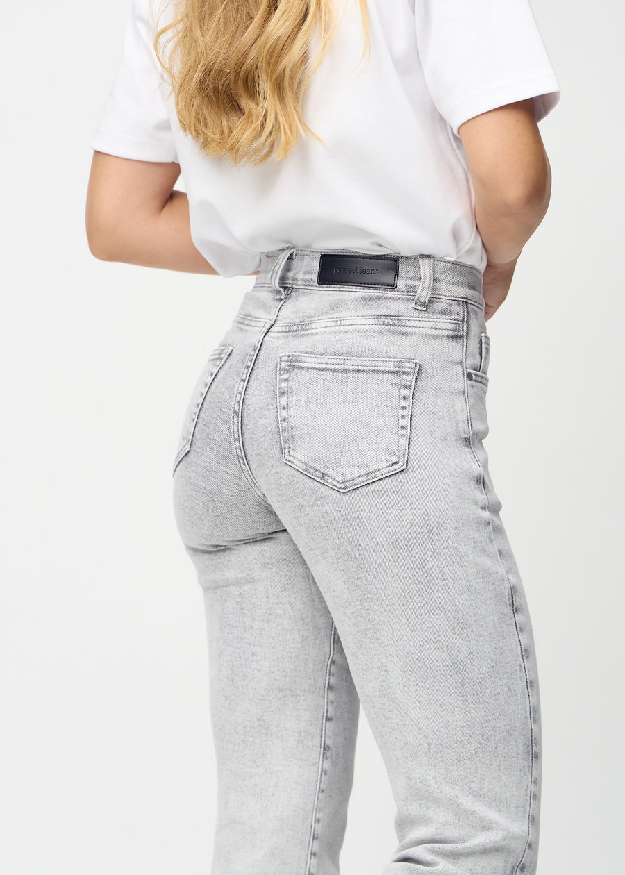 Regular jeans for women in light grey, color Ashes. Close-up from behind on a model, showing fit and details.