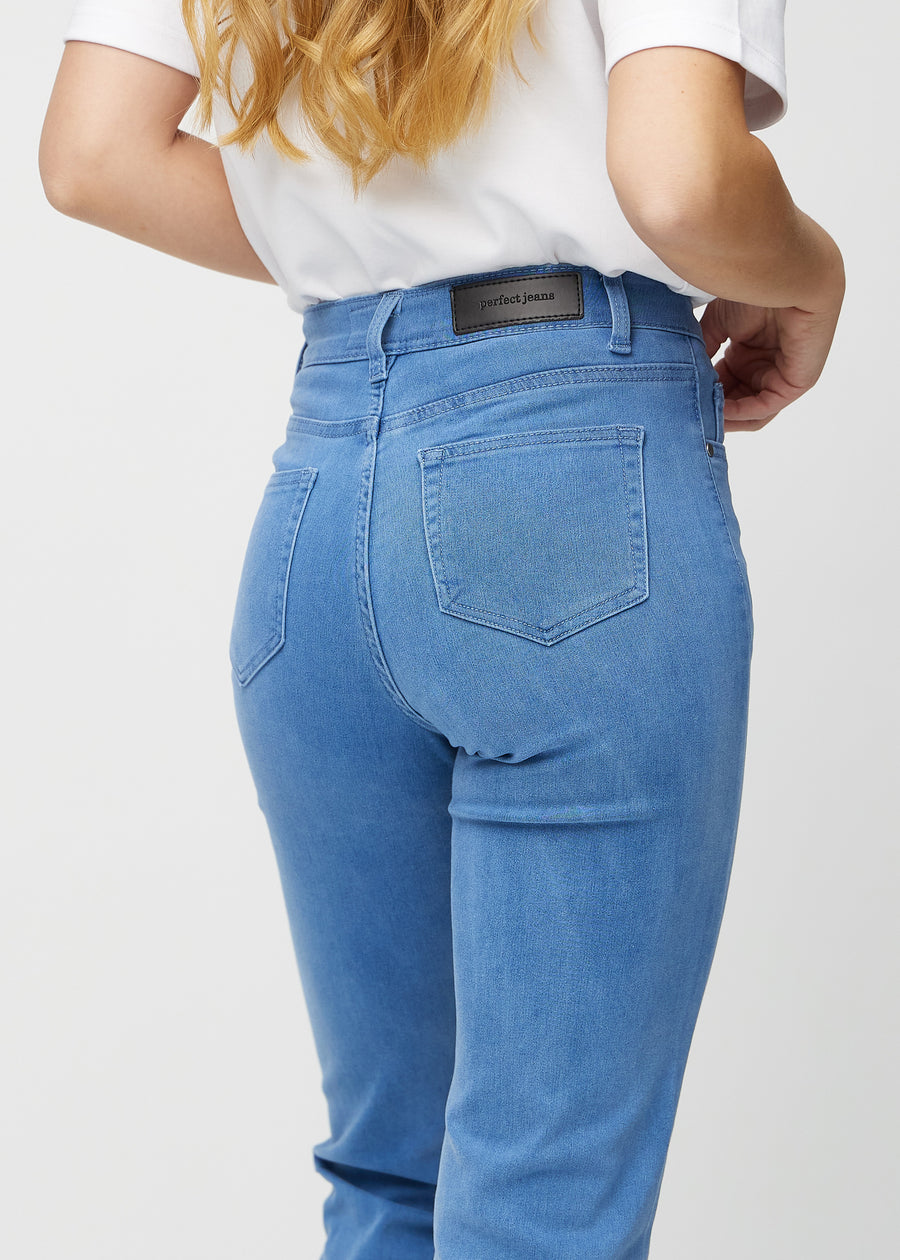 Regular jeans for women in blue, color Geraniums. Close-up from behind on a model, showing fit and details.