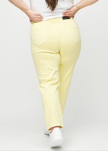 Regular jeans for women in light yellow, color Lemonades. Back view on a plus-size model, showing the full fit.