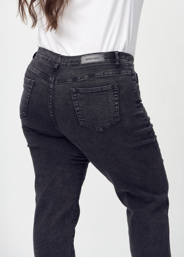 Regular jeans for women in dark grey, color Shadows. Close-up from behind on a plus-size model, showing fit and details.