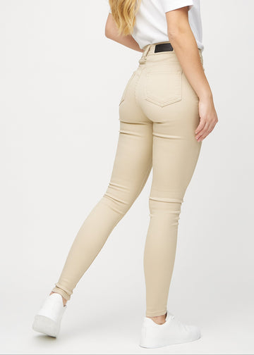 Skinny jeans for women in beige, color Gazelles. Back view on a model, showing the overall fit.