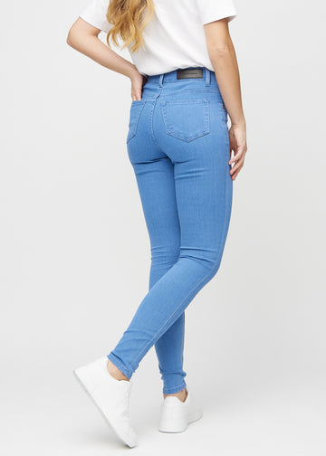 Blue skinny jeans seen from the back, so the entire product can be seen.