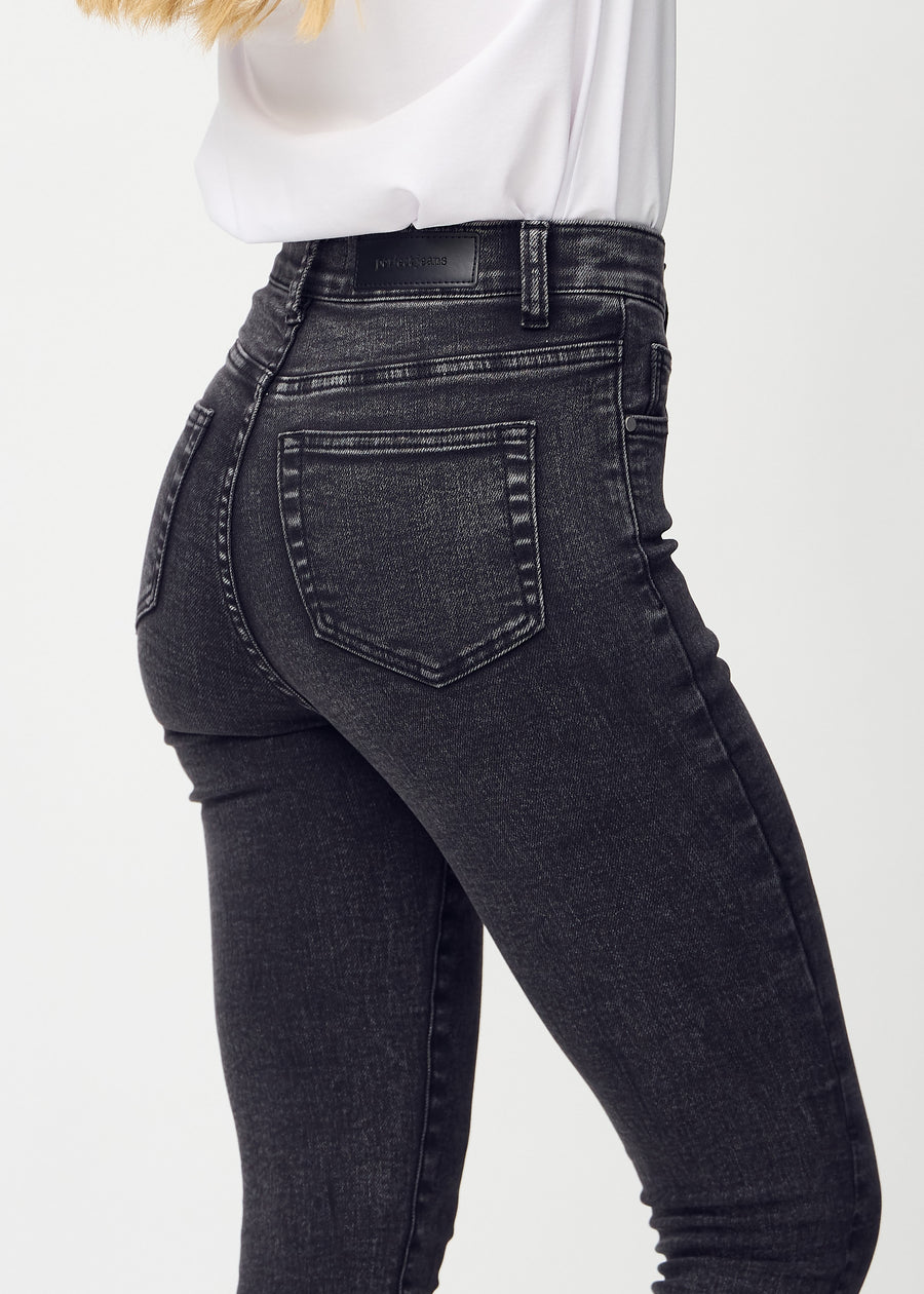 Skinny jeans for women in dark grey, color Shadows. Close-up back view on a model, showing details.
