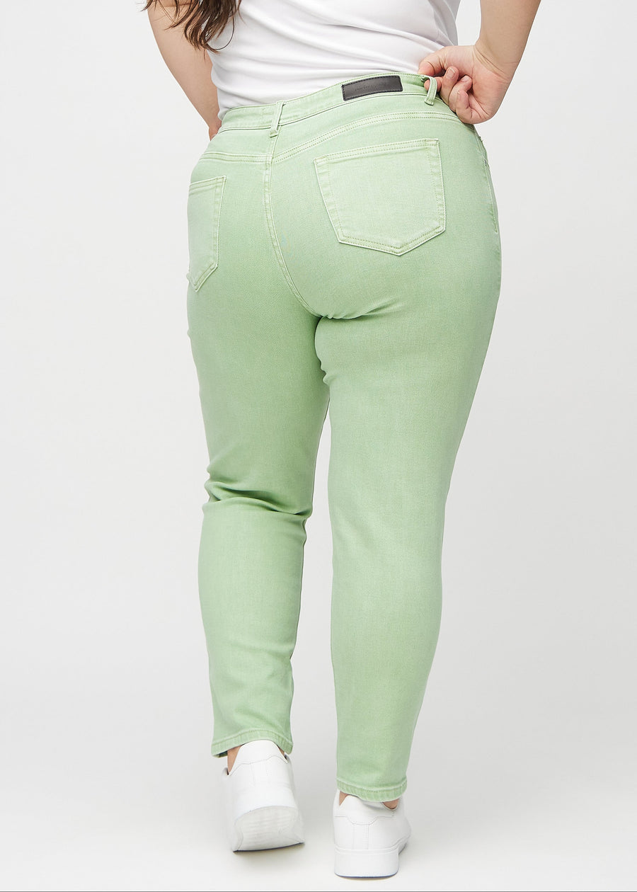 Slim jeans for women in light green, color Mints. Back view on a plus-size model, showing the overall fit.