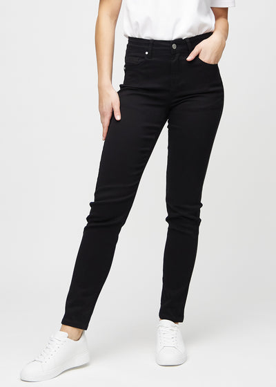 Black slim jeans, model name Ravens, which fit closely to the leg, though slightly looser at the ankle, seen from the front.