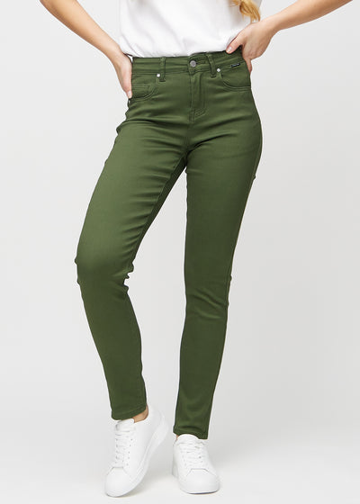 Slim jeans for women in dark green, color Renewals. Front view on a model, showing a close fit through the leg with a little more room at the ankle.