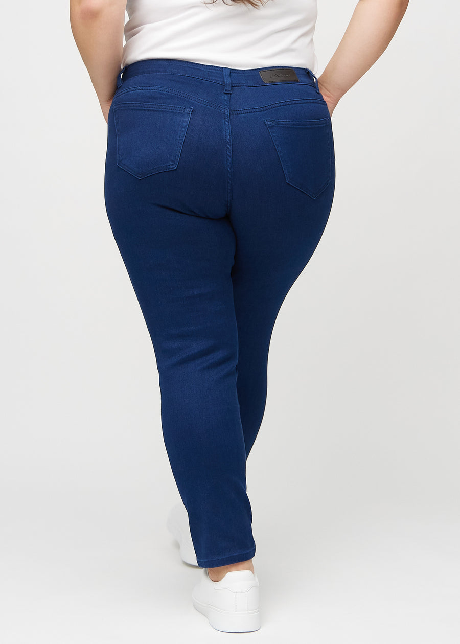 Slim jeans for women in dark blue, color Royals. Back view on a plus-size model, showing the overall fit.