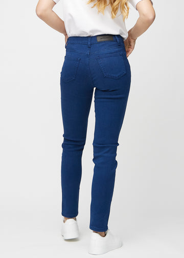Slim jeans for women in dark blue, color Royals. Back view on a model, showing the overall fit.