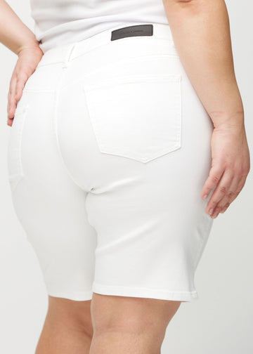 White regular middle shorts seen from the back close up on a plus-size model to show details.