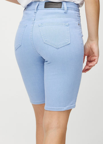Light blue skinny middle shorts seen from the back close up to show details.