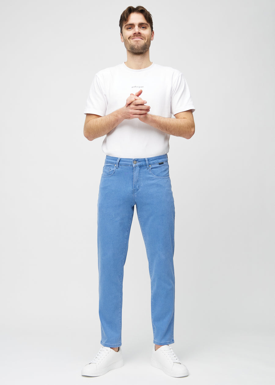 Full image of model in blue regular jeans.