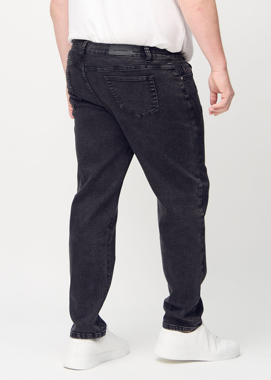 Dark grey denim regular jeans viewed from the back on a plus-size model, so the entire product can be seen.