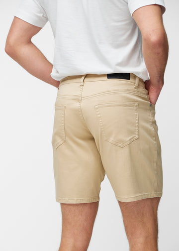 Beige shorts for men in the colour Gazelles seen from the back close up to show fit and details.