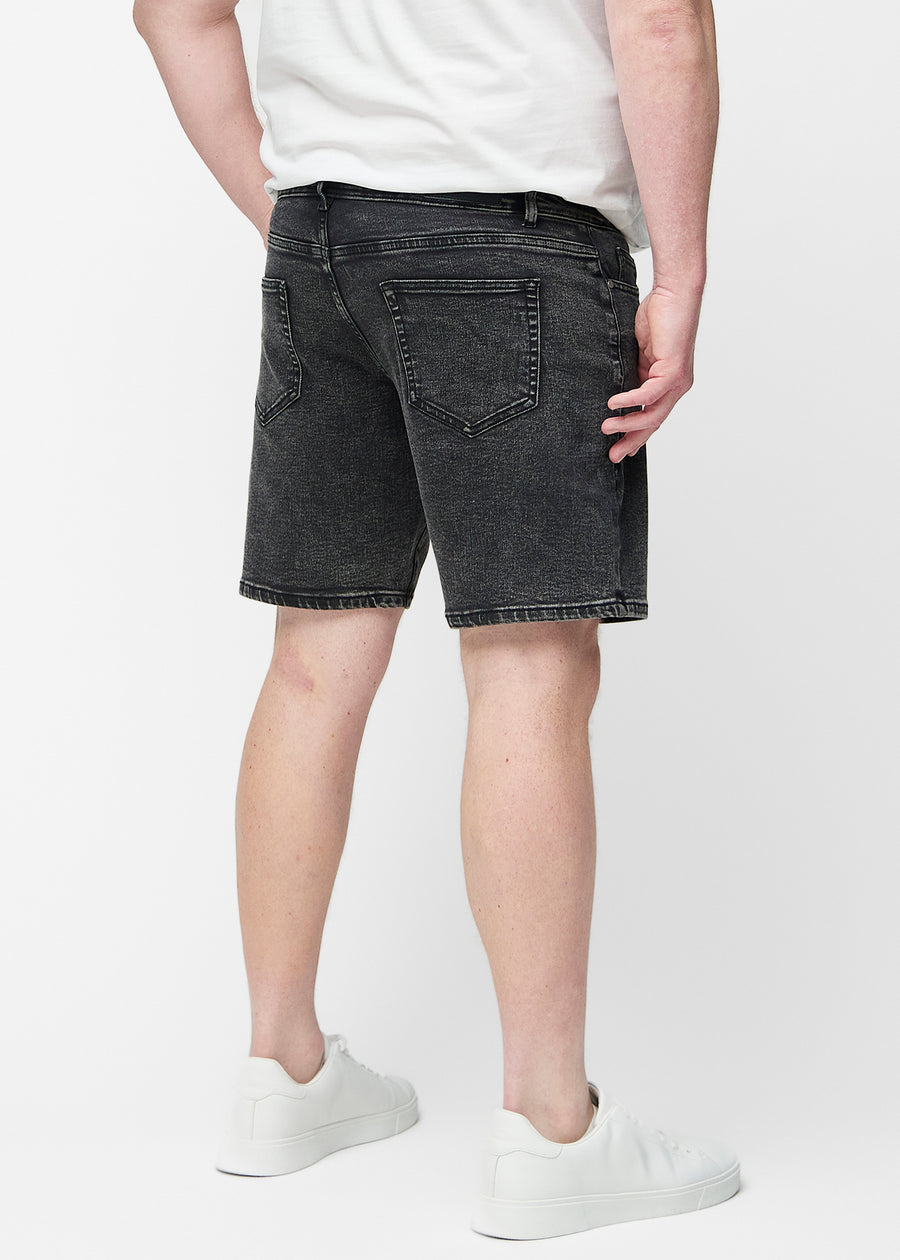 Dark grey denim shorts for men in the colour Shadows seen from the back on a plus-size model.