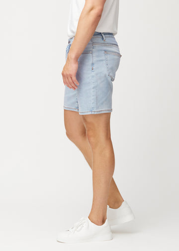Light blue denim shorts for men in the colour Waves with a regular fit seen from the side on a model.
